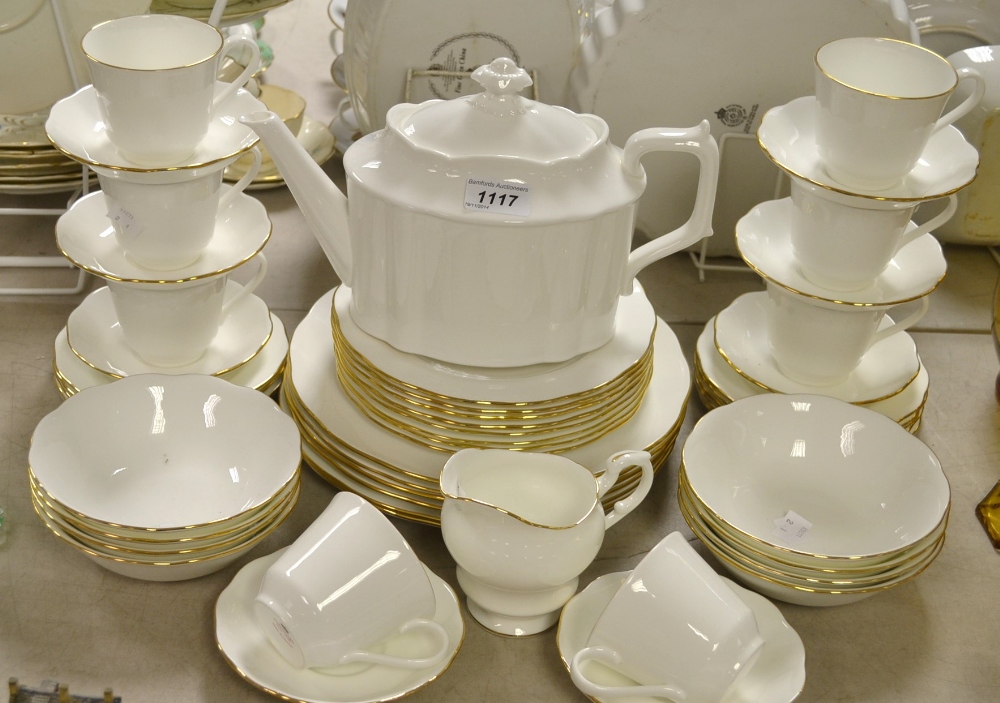 A Colclough dinner service, plain white ground with gilt bands, comprising dinner plates, bowls,