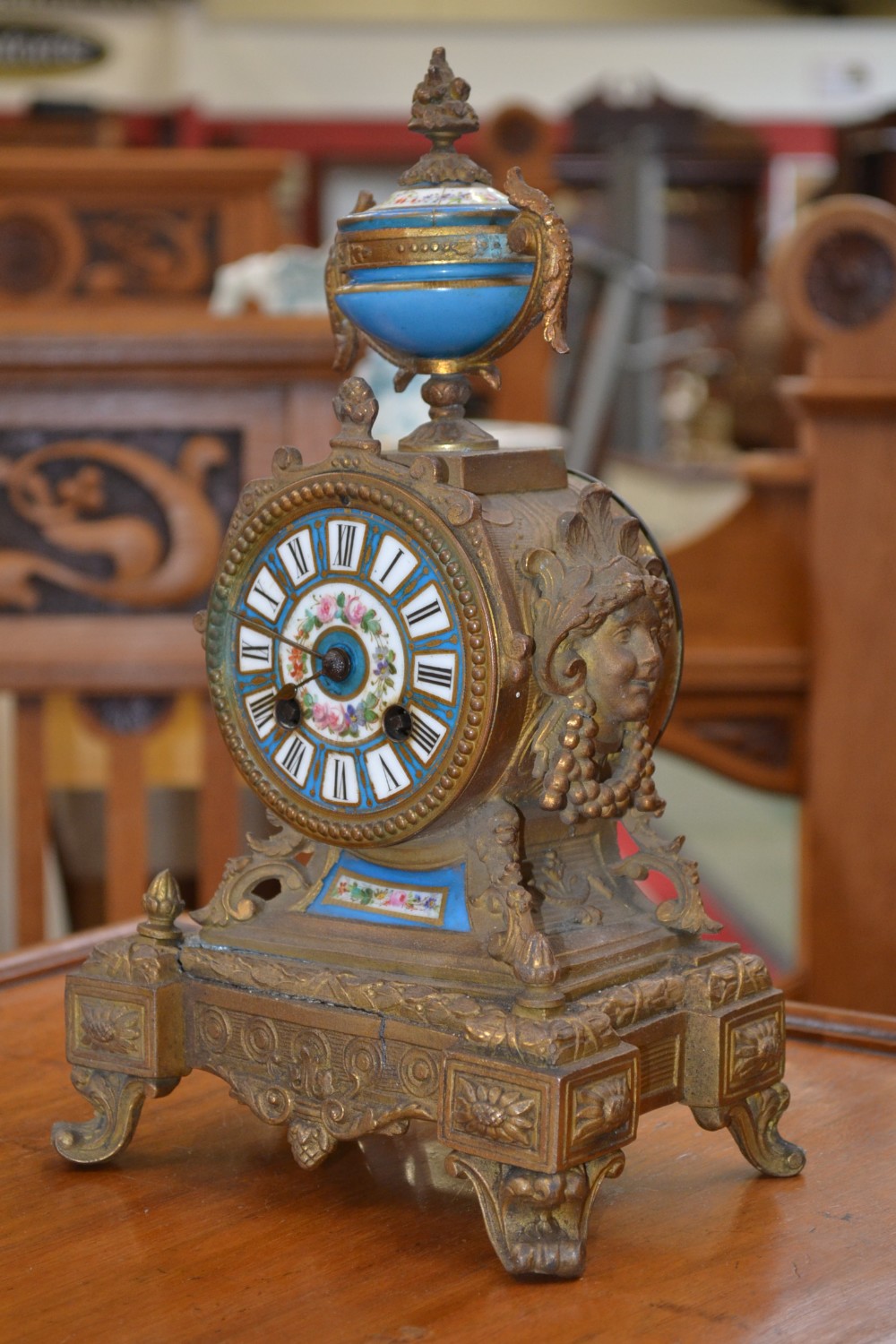 A French mantel clock, striking on a bell, porcelain dial and mounts, key, c.1880