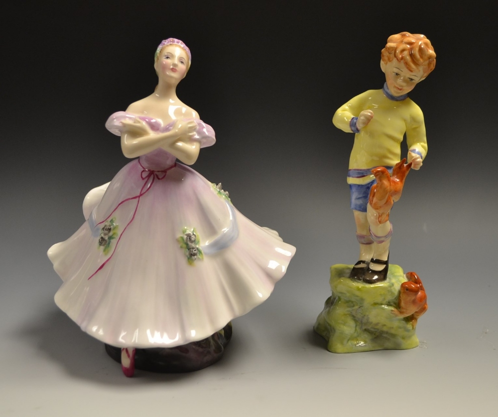 A Royal Worcester figure October, designed by Freda Doughty, 3417, printed marks; a Royal Doulton