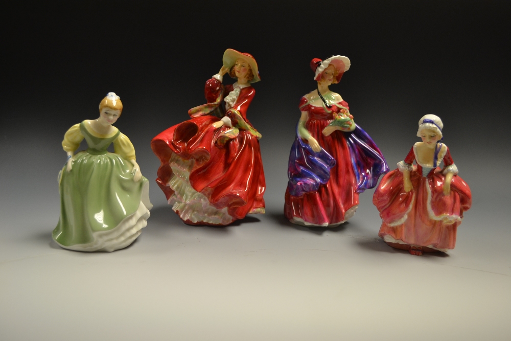 A Royal Doulton figure, April HN 1958, hand painted; another
Top 'o' The Hill, HN1834; two others