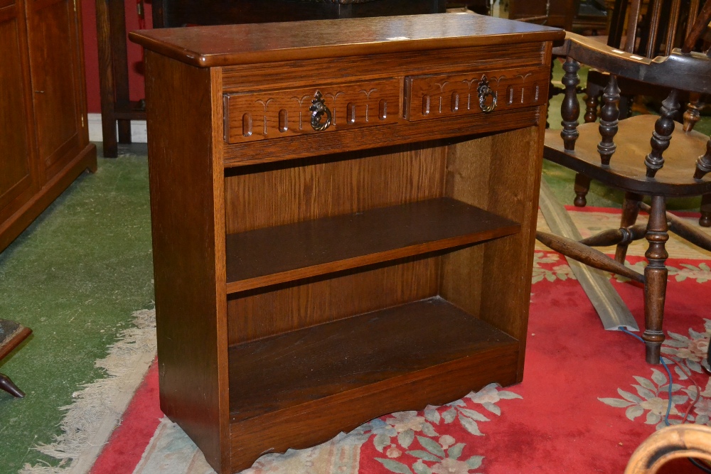 Grangemoor Furniture - an oak bookcase, single shelf, two drawers to frieze