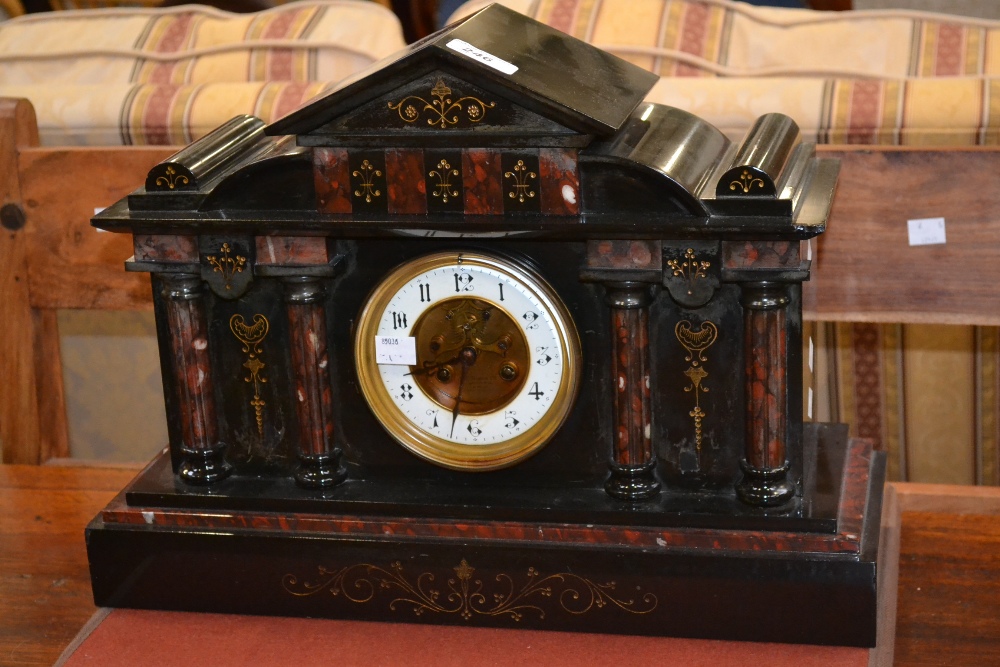 A Victorian black marble mantel clock, architectural pediment, enamelled chapter ring, Arabic