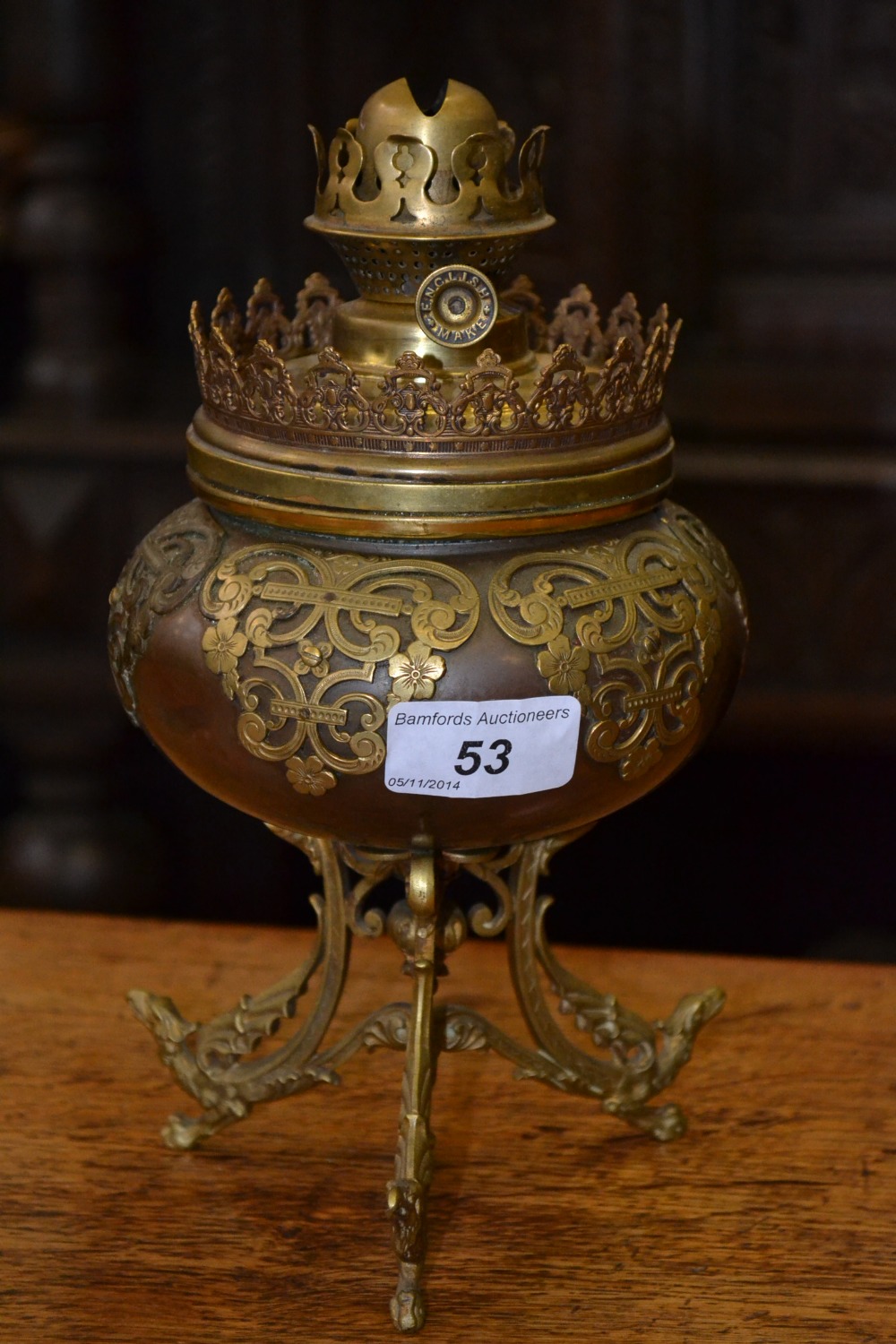 A Victorian brass and copper oil lamp