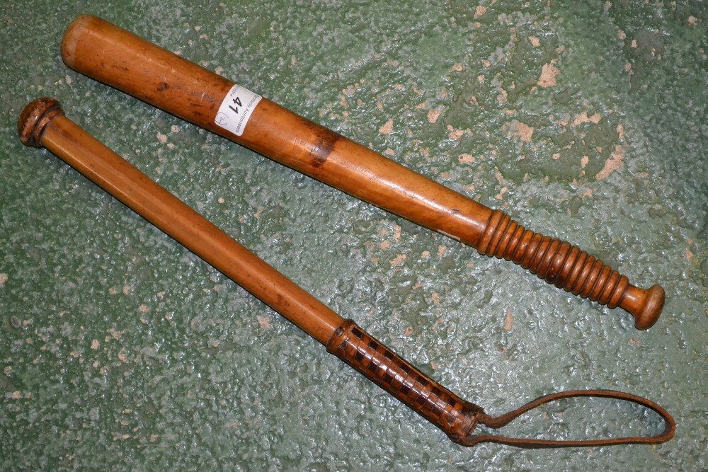 A truncheon; a cosh, leather handled (2)