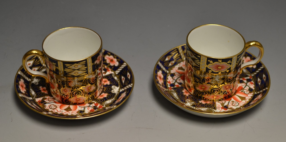 A pair of Royal Crown Derby 2451 coffee cans and saucers, printed marks