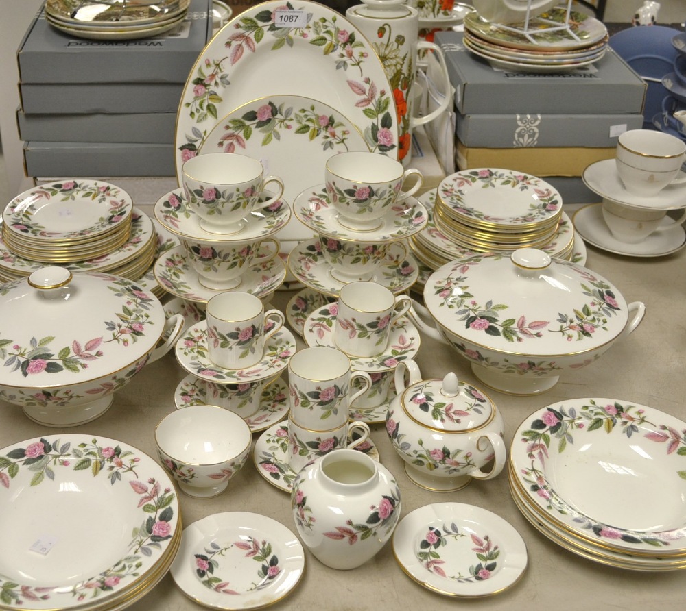 A Wedgwood Hathaway rose pattern dinner service comprising of plates, cups, saucers, dishes, etc