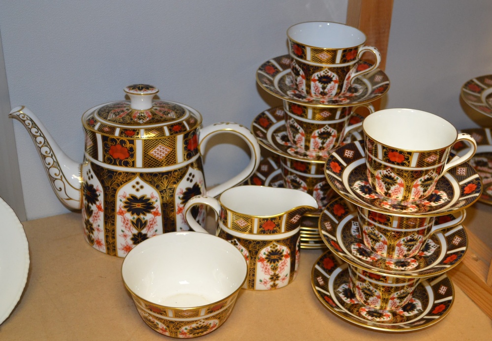 A Royal Crown Derby 1128 Imari six setting tea set, including teapot, milk jug, sugar bowl and six