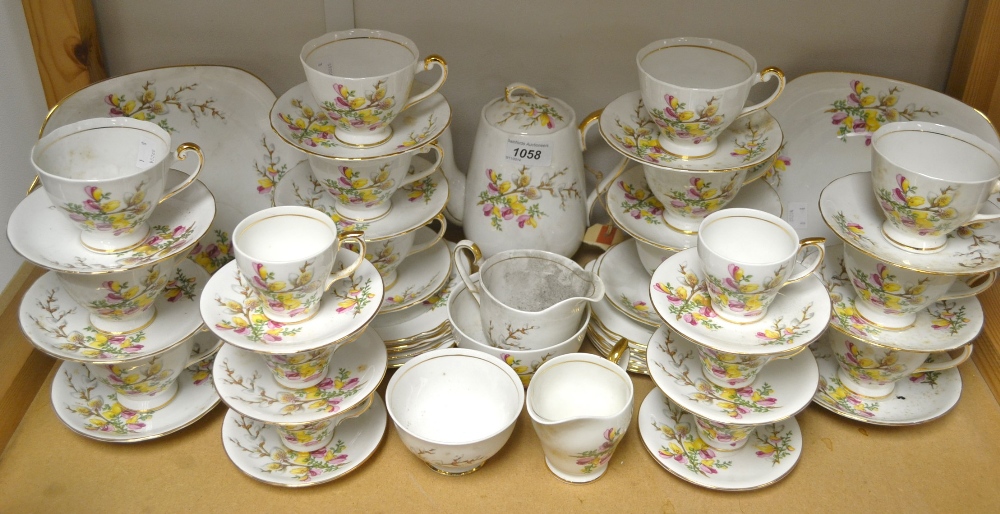 A Windsor China tea set, printed with floral sprays, comprising ten tea cups, twelve saucers, milk