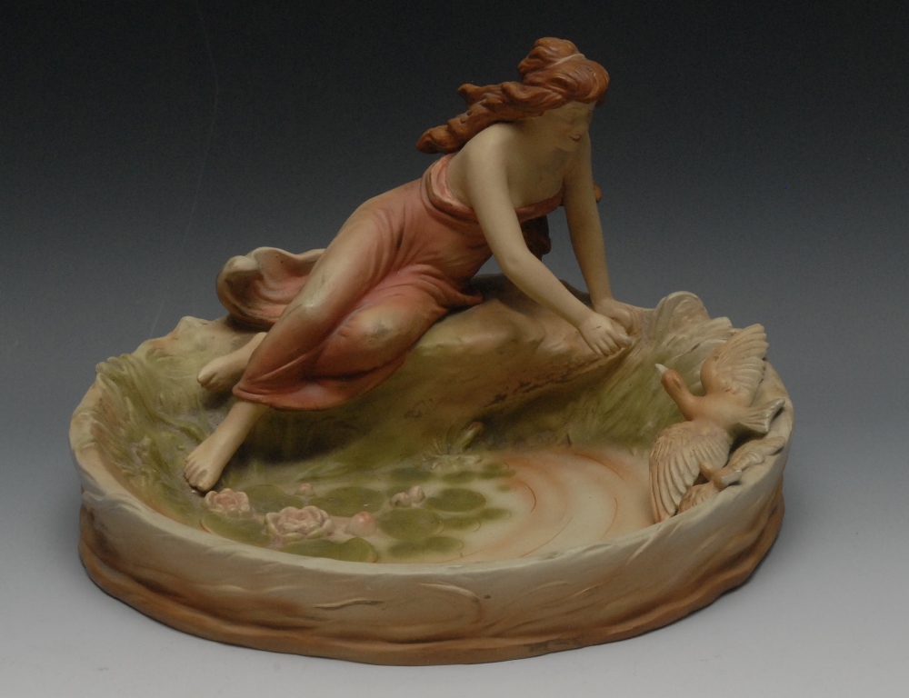 An Art Nouveau Hohenstein pottery table centrepiece, in the Dux manner, modelled as a maiden