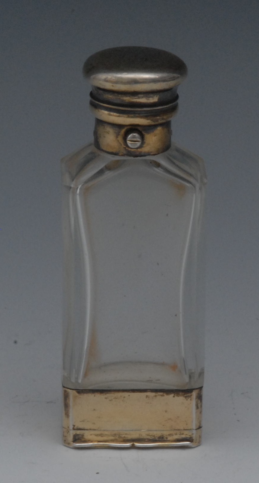 A Victorian silver-gilt mounted clear glass combination scent bottle and vinaigrette, hinged domed