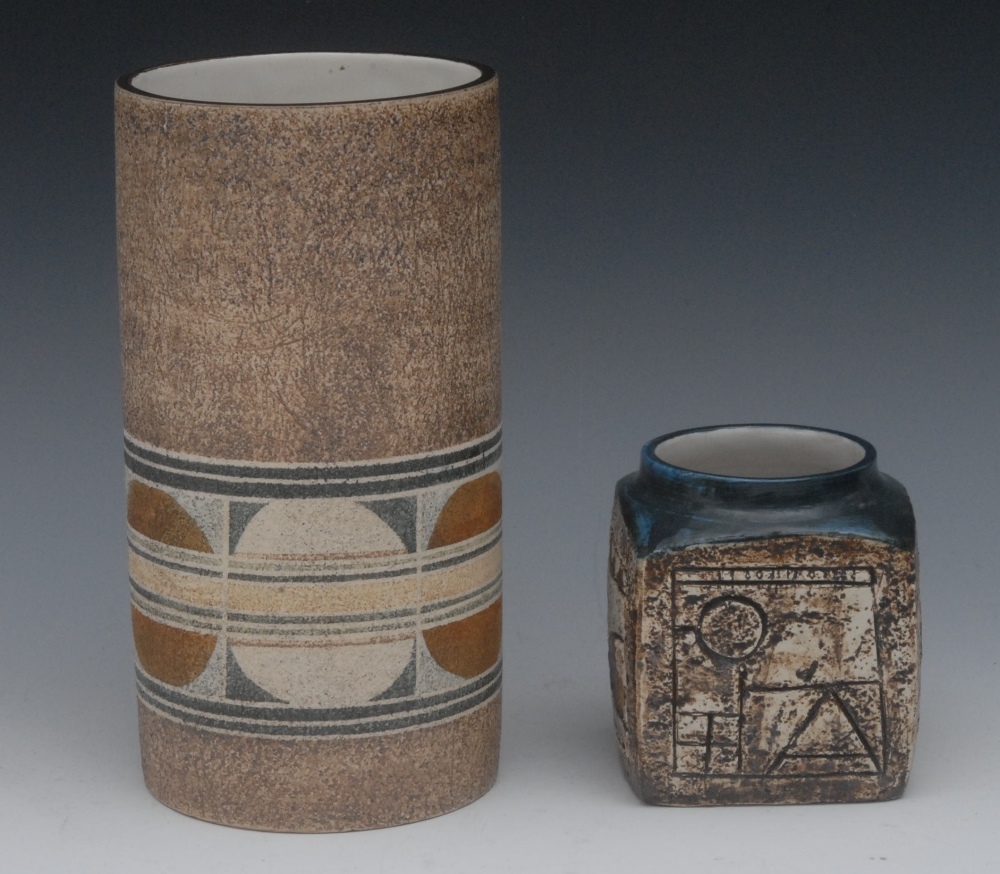 A Troika cube vase, incised with geometrical motifs and roundels in tones of tan and blue, 9cm high,