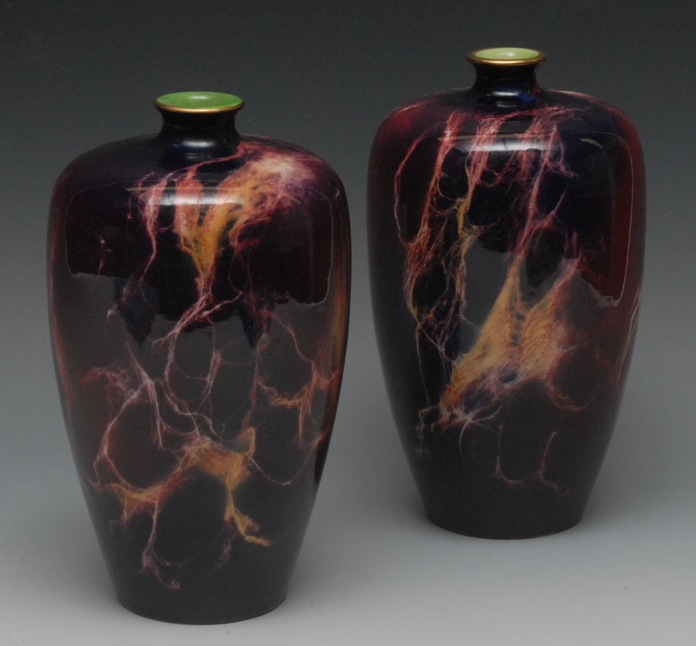 A pair of Wilkinson Oriflame ovoid vases, in a mottled purple lustre ground, 22cm high, printed