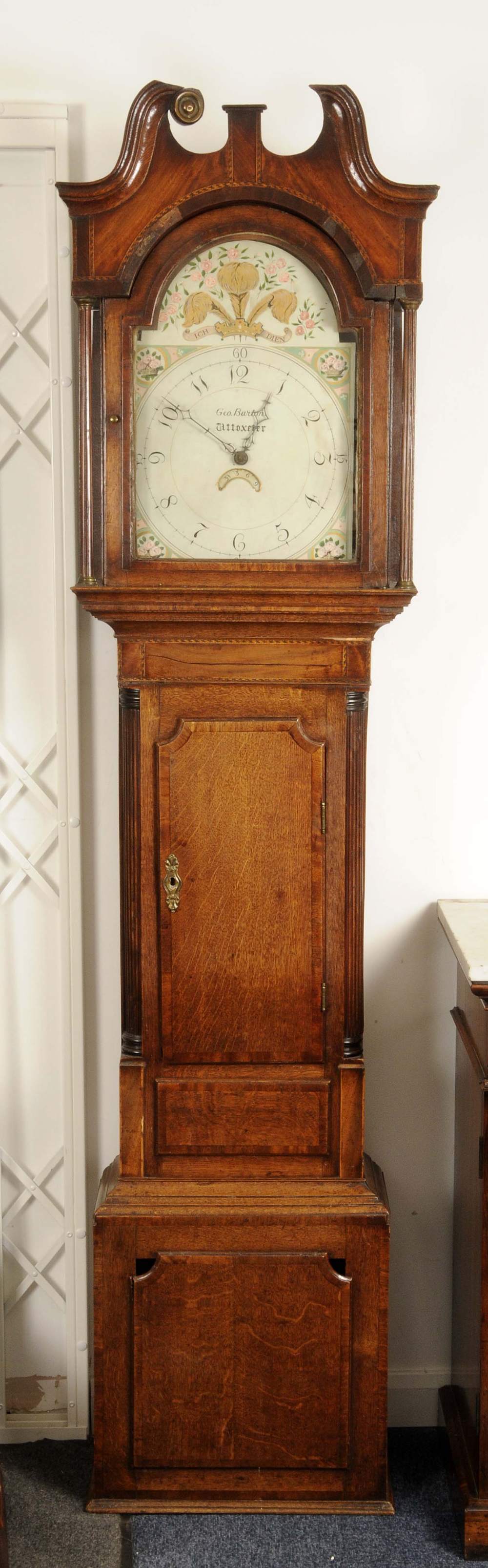A George III mahogany crossbanded oak longcase clock, 31cm arched painted dial inscribed George