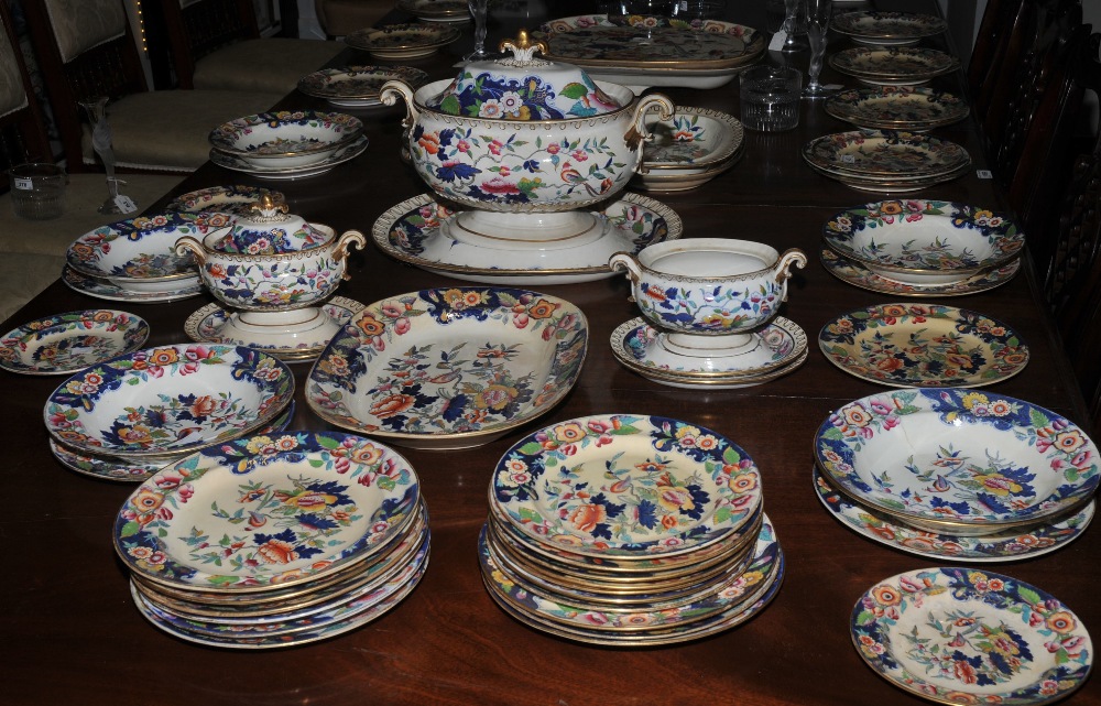 An extensive Victorian Staffordshire  dinner service, printed with fanciful birds and flowers in