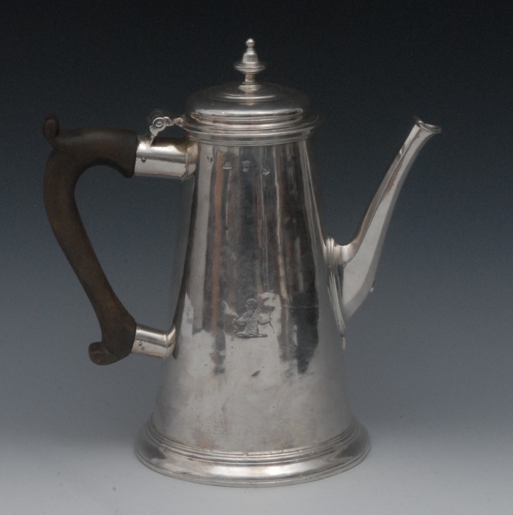 A George II silver conical coffee pot, hinged raised cover with knop finial, scroll-capped fruitwood