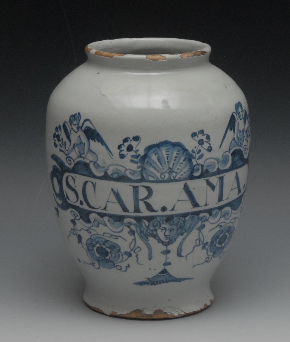 An 18th century Delft dry drug jar, inscribed S.CAR.AMA within a cartouche centred by a shell and