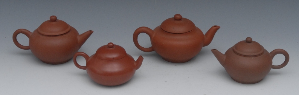 A Chinese Yixing miniature teapot and cover, ball finial, 7.5cm high, seal mark;  another, similar;