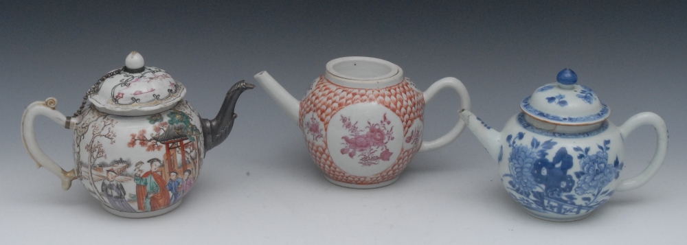 An 18th century Chinese blue and white globular teapot and cover, decorated with peonies, fence
