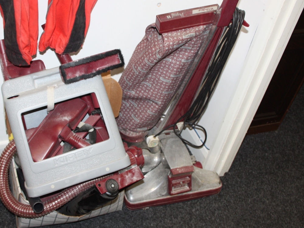 A  Kirby Legend II vacuum cleaner with attachments