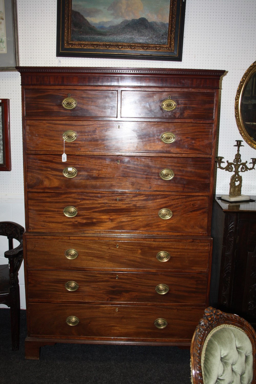 A George III mahogany chest on chest, dental cornice, above two short and three long graduated