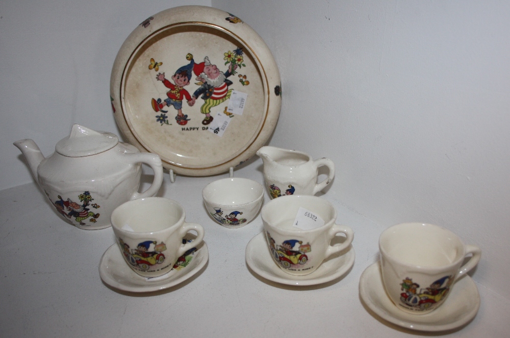 A Noddy Interest - a child's tea set for three, comprising teapot, milk and sugar, teacups and