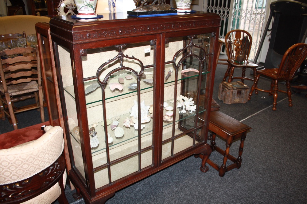 A mahogany display cabinet, Greek key frieze above glazed doors