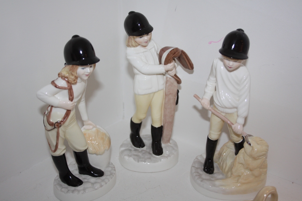 A set of three Coalport figures; modelled by Pauline Shone, The Riding Lesson, Feeding Time,