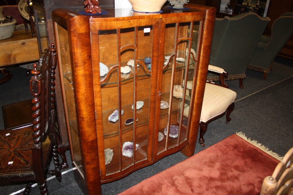 A 1930's bow fronted display cabinet