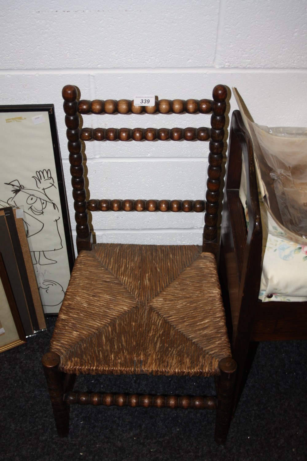 A 19th century bobbin turned childs chair, rush seat