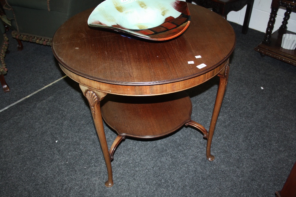 An early 20th century walnut two tier centre table, cylinder top, cabriole legs in the Queen Anne