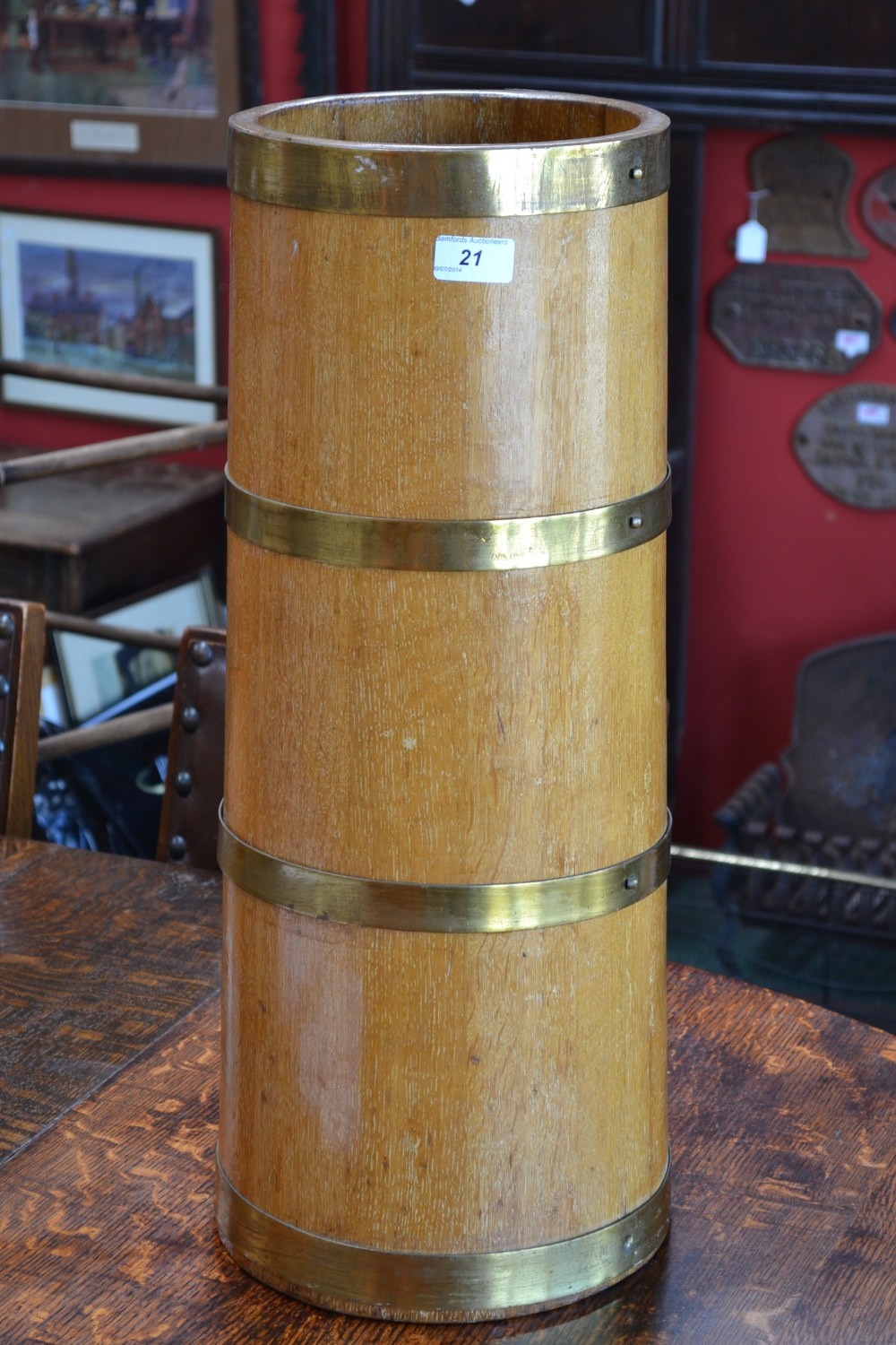 A brass coopered oak spreading cylindrical stick stand