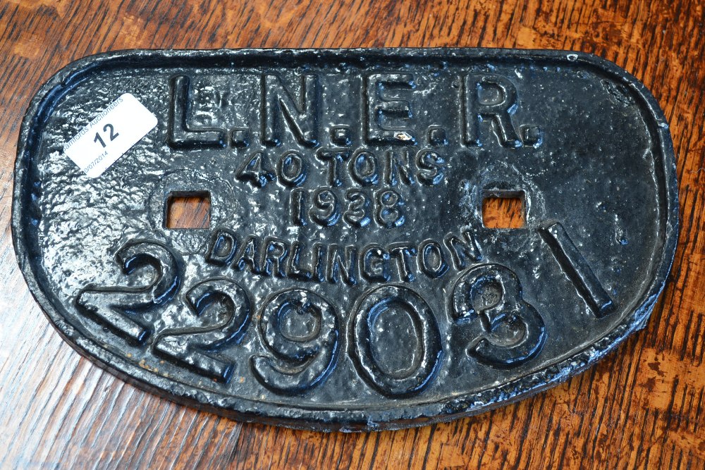 Railwayana - a painted cast iron and shaped wagon plate, painted black with raised lettering 'L.N.