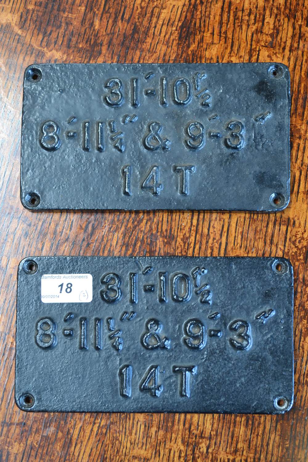 Railwayana - two painted cast iron rounded rectangular wagon plates, each painted black with