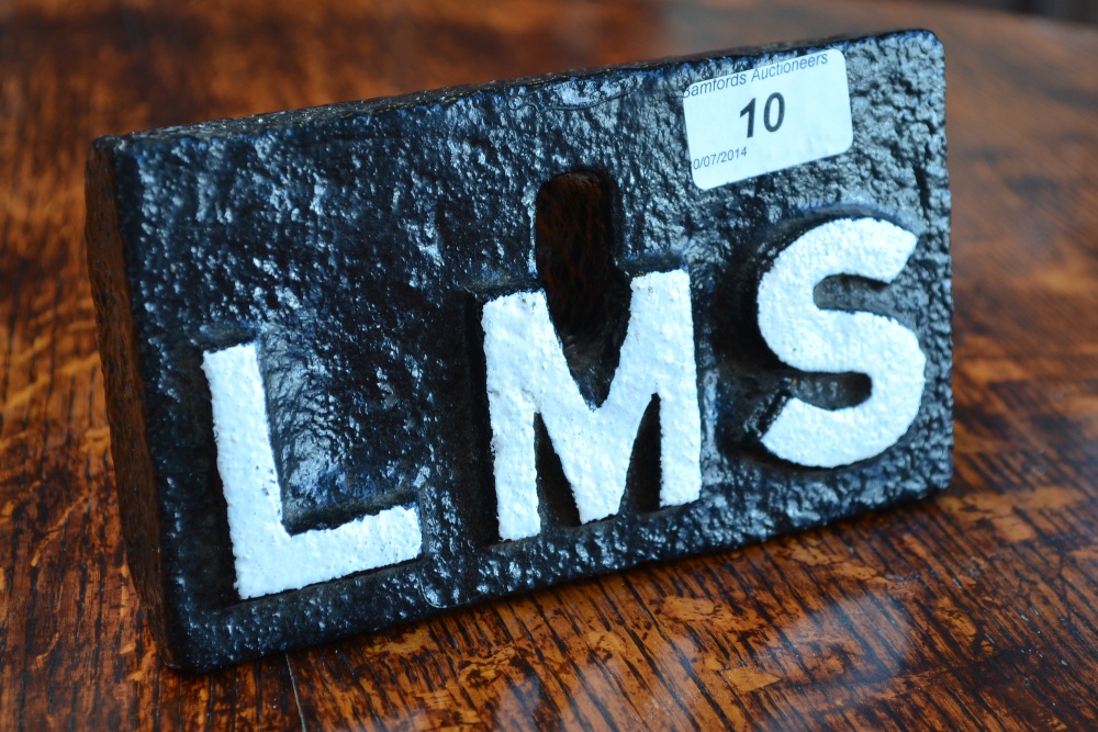 Railwayana - an LMS painted cast iron weight, raised white lettering on a black ground 'LMS', 10cm x