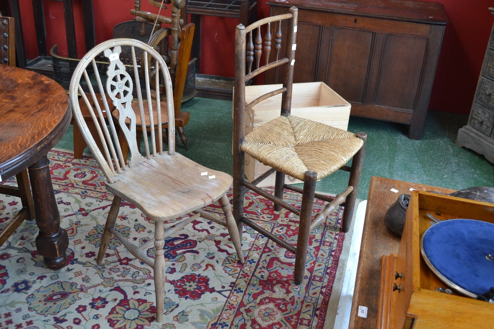 A rush seated  country chair, spindled back; another, wheelback (2)