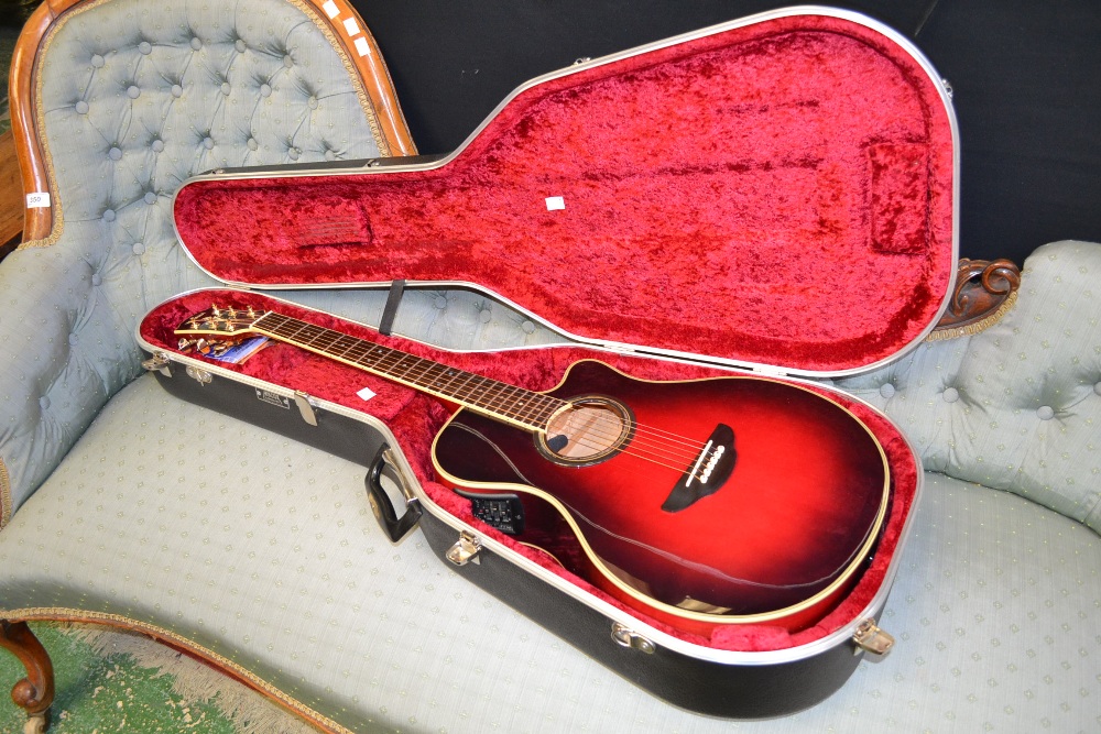 A Yamaha APX-9C electric guitar, with case