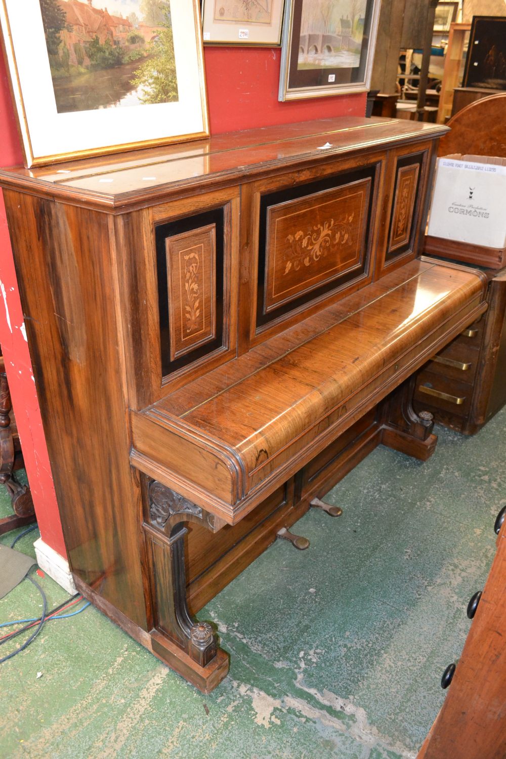 A John Broadwood & Sons, London rosewood upright piano inlaid with scrolling satinwood flora.