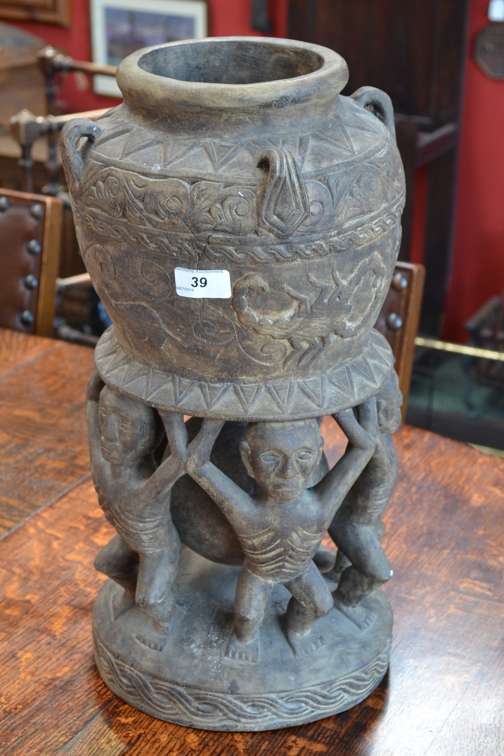 Tribal art - An African carved wooden pot on stand