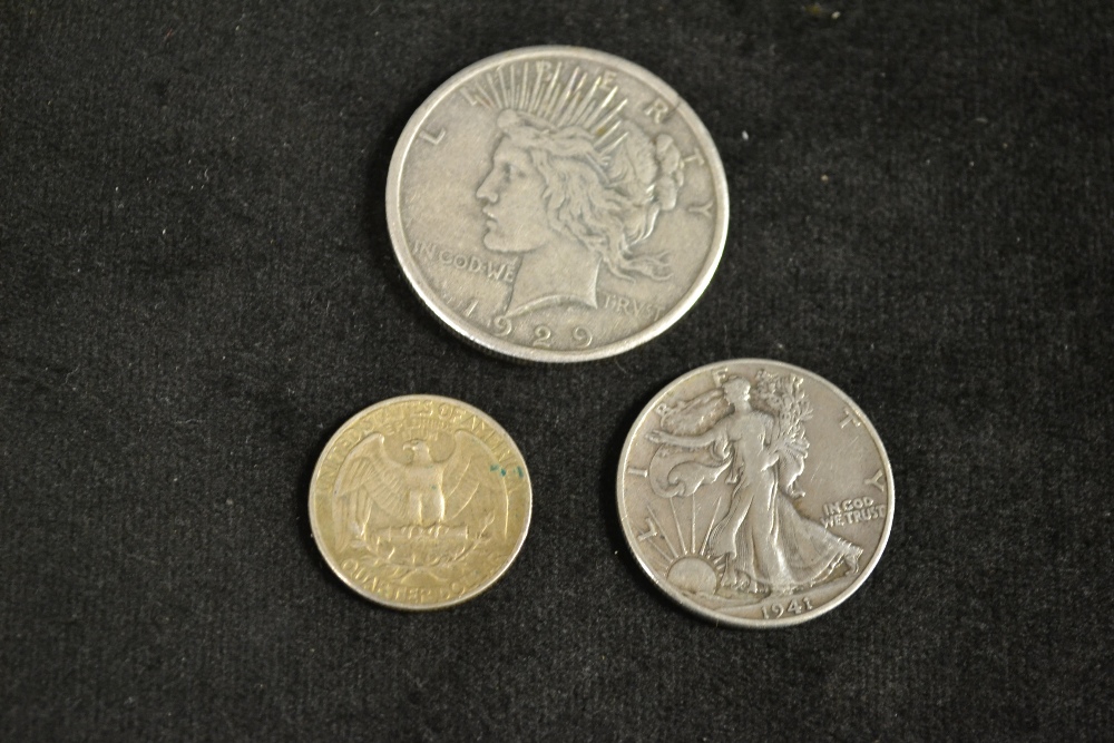 Coins - An American dollar, 1929; half dollar, 1941; quarter dollar, 1946 (3)