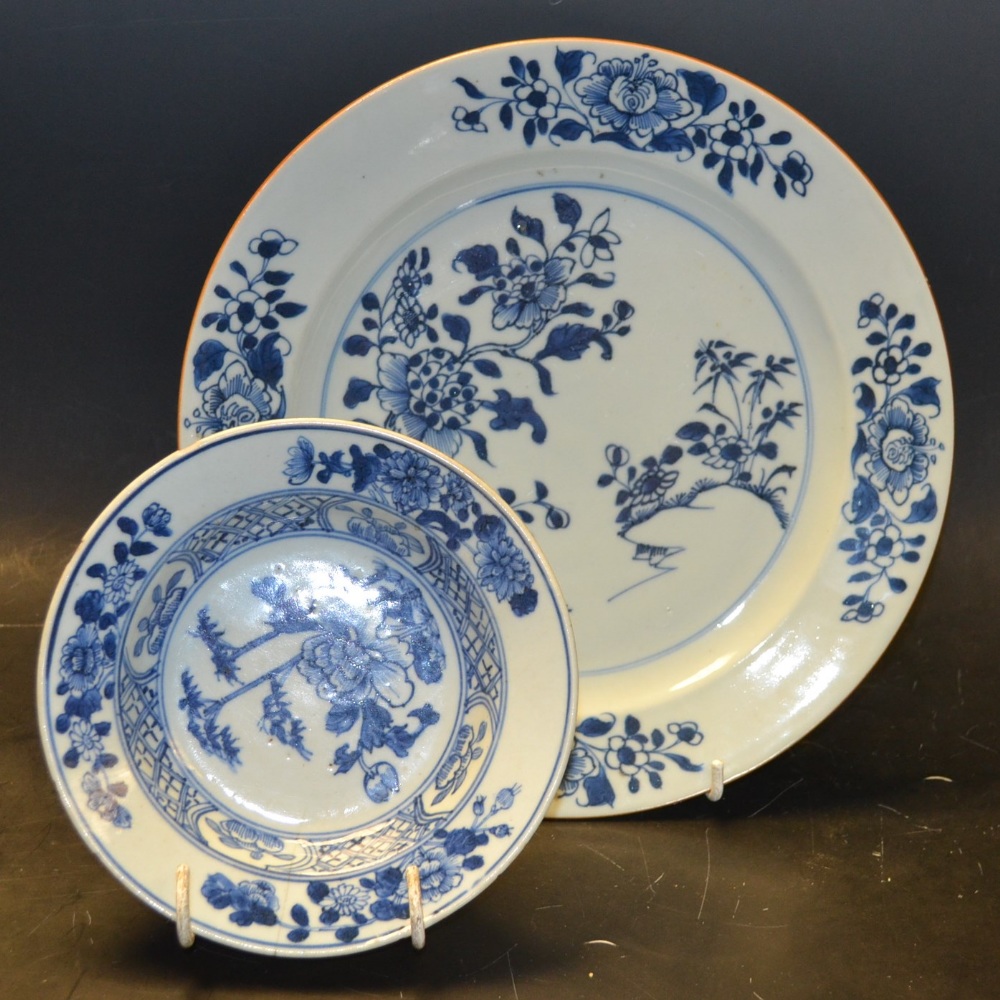A Chinese blue and white porcelain circular plate, painted underglaze with peonies and rocky