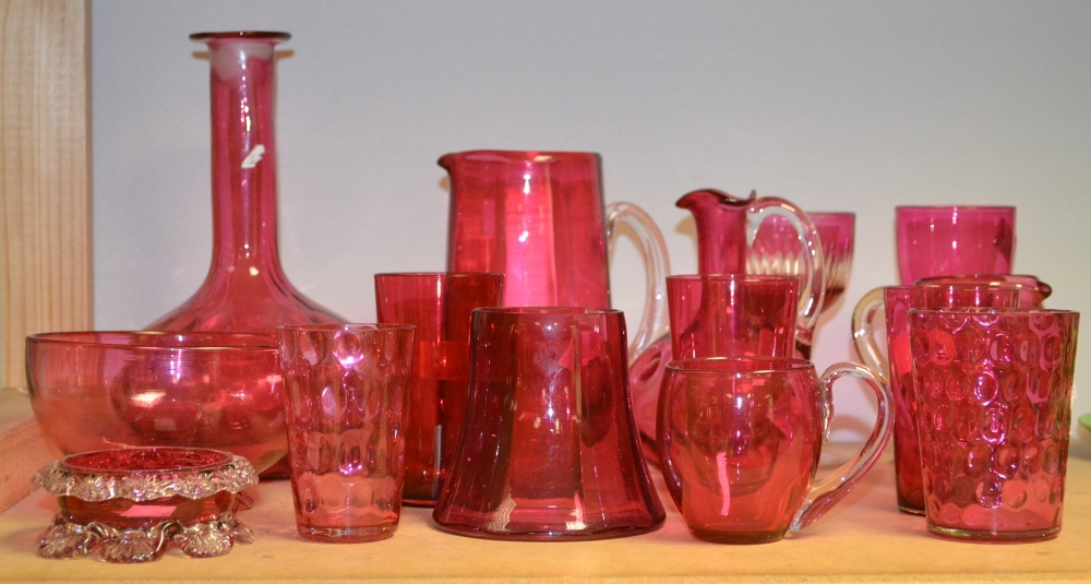 Glass - Victorian cranberry glass, including a faceted jug; a globular decanter; a trio of