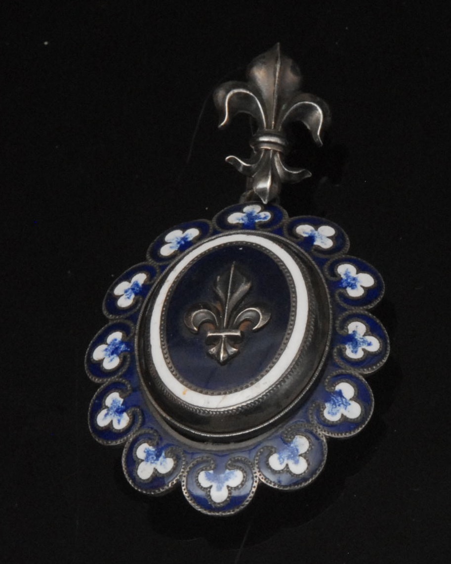 A 19th century French enamelled Fleur de Lys mourning locket/pendant, oval body, raised central