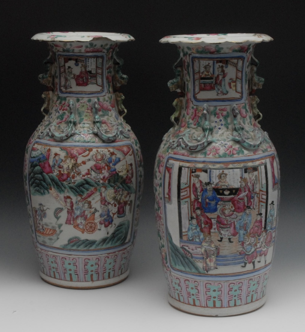 A pair of Cantonese ovoid vases, each painted in the Famille Rose palette with an official and