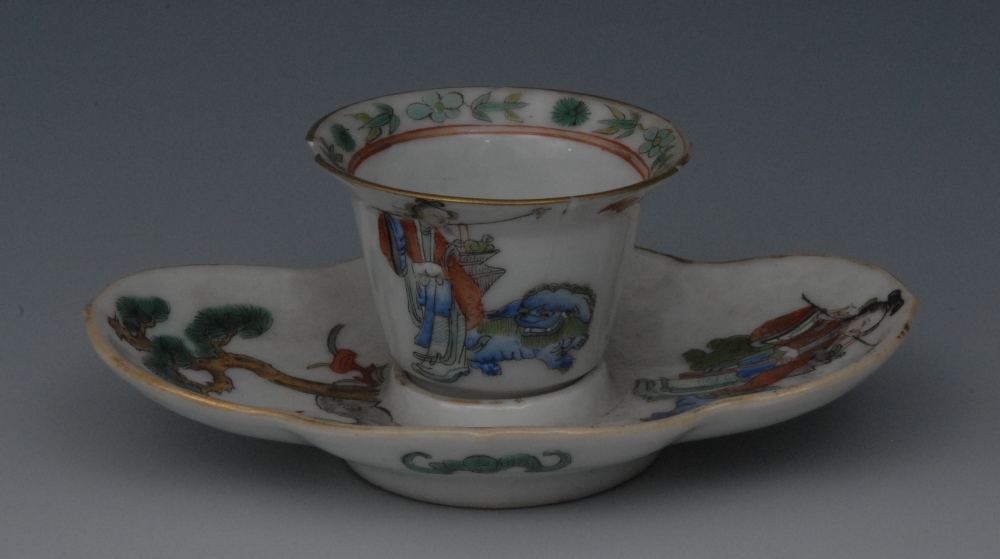 A Chinese porcelain flared wine cup and quatrefoil stand, painted in polychrome enamels with a