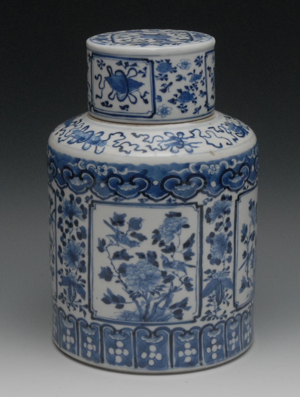 A Chinese porcelain cylindrical jar and cover, painted in underglaze blue with birds, flowers and