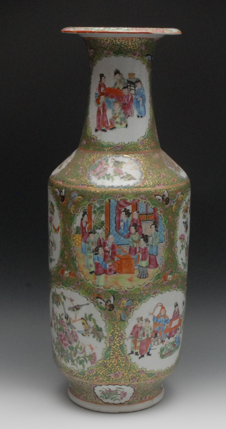 A large Cantonese porcelain vase, painted in the Famille Rose palette with figures of the court,