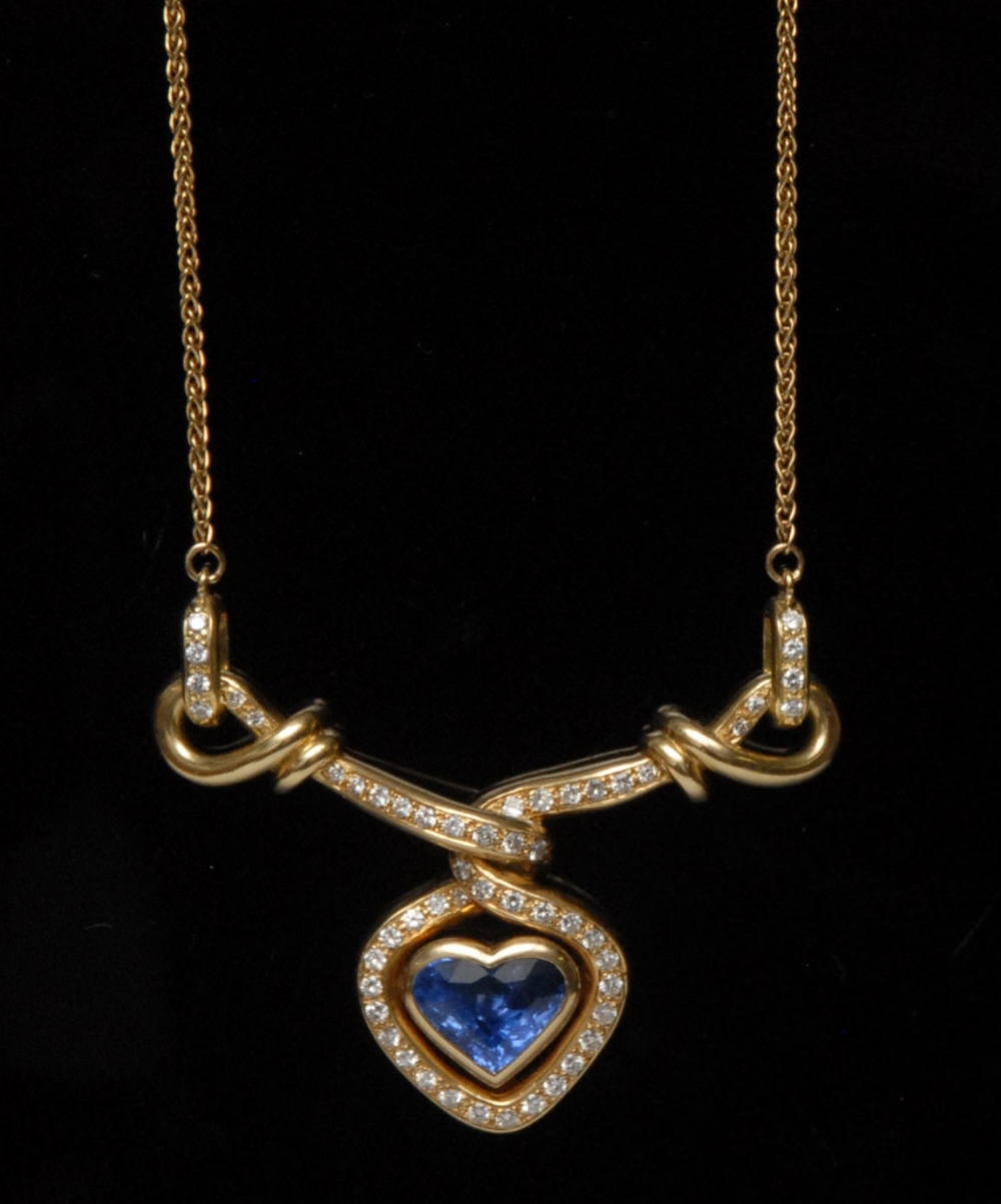 A heart shape sapphire and diamond necklace, central pale blue heart  sapphire approx. 4.60ct,