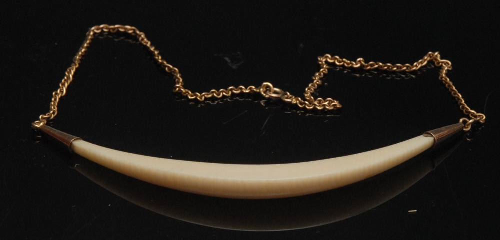 A 19th century French ivory necklace, tapering ivory crescent central section, unmarked 18ct