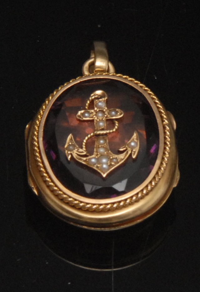 A 19th century French high carat gold amethyst and seed pearl anchor locket, central oval facetted