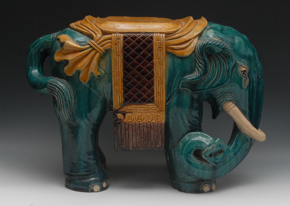 A Chinese garden seat, as an elephant, standing four square, dressed with a howdah, coloured in